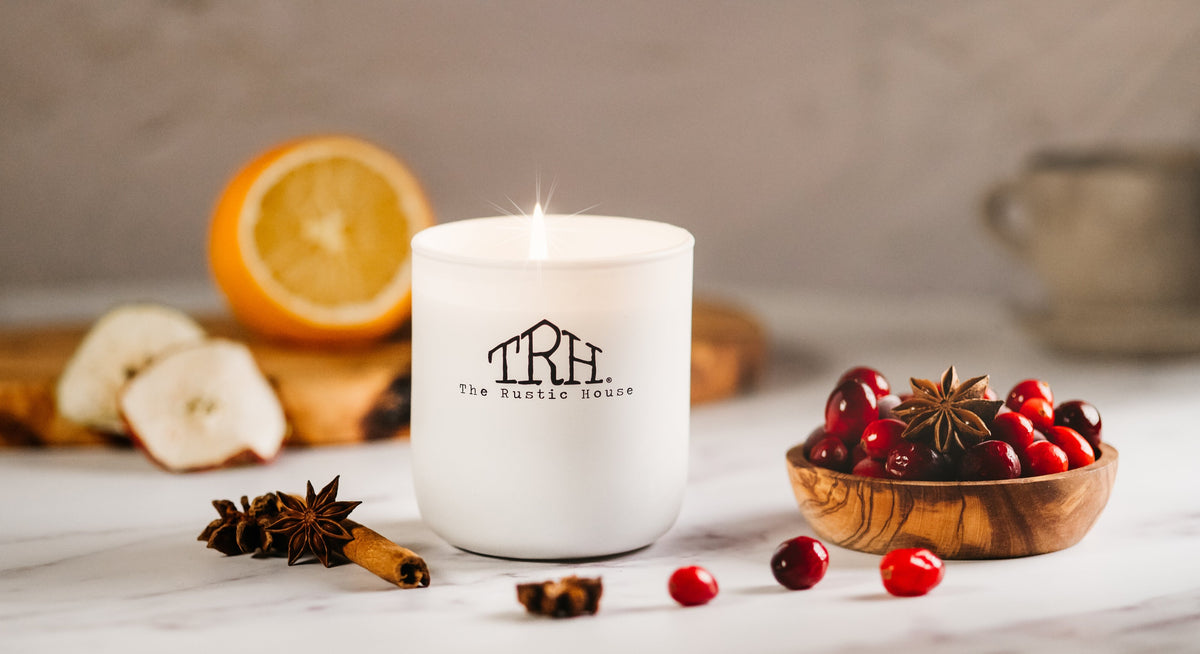 Lit Rustic House candle with orange and cranberries